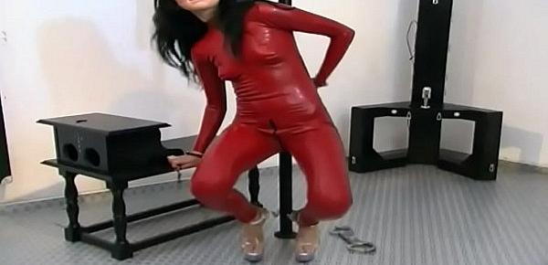  Girl in red latex gets rid from any chain